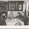 Mr. and Mrs. George Hutton, their son, and grandson at dinner. The younger Mr. Hutton homesteaded his own place, but he is now a widower and lives and farms with his father. Pie Town, New Mexico