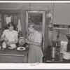 Mother and daughter working in the cafe kitchen. The daughter with her husband run the cafe. Pie Town, New Mexico