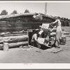 Mr. and Mrs. Caudill moving furniture from their dugout. Pie Town, New Mexico