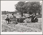 Farmer and his younger brother with tractor which has been adapted from truck. Pie Town, New Mexico