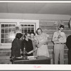 Farmers and wives singing at the literary society. Pie Town, New Mexico