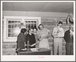 Farmers and wives singing at the literary society. Pie Town, New Mexico