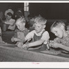 Youngsters modeling in clay at the private school in the Farm Bureau building. Pie Town, New Mexico