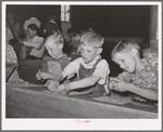 Youngsters modeling in clay at the private school in the Farm Bureau building. Pie Town, New Mexico