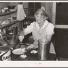 Mrs. Holley, Sr., dishing up ice cream. Pie Town, New Mexico
