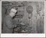 George Hutton Sr., in the machine shop on his farm. Pie Town, New Mexico