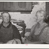 Mr. and Mrs. George Hutton, Sr., homesteaders from Oklahoma. Mr Hutton says, "There is nothing I'd rather see less than a cotton field." Pie Town, New Mexico