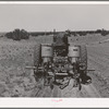 George Hutton, Jr., planting beans. Pie Town, New Mexico