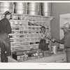 Mr. Craig handing sackful of nails to a farmer. Pie Town, New Mexico