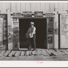 Mr. Keele, merchant and president of the Farm Bureau, in front of the general store. Pie Town, New Mexico
