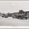 Trucks from a small sawmill stand in front of the cabins at Pie Town, New Mexico