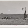 Beef cattle and windmill on farm of George Hutton. Pie Town, New Mexico