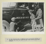In the civilian camp in Teheran Polish boy-scouts welcome an American Red Cross car which brought them clothing and other relief.
