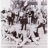 New York City Ballet posed on steps with George Balanchine in the center