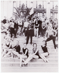 New York City Ballet posed on steps with George Balanchine in the center