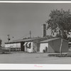 Dairy barn which contains milking stalls, cooling equipment, cream separator and cold storage locker. Casa Grande Valley Farms, Pinal County, Arizona