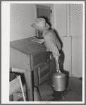 Writing down weight of milk given by one cow at the Casa Grande Valley Farms. Pinal County, Arizona. Exact and completed milk records are kept on all dairy cows
