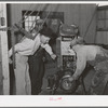 Members and FSA (Farm Security Administration) officials at Casa Grande Farms making repairs in farm machinery. Pinal County, Arizona