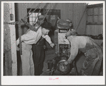 Members and FSA (Farm Security Administration) officials at Casa Grande Farms making repairs in farm machinery. Pinal County, Arizona