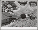 Looking down on the miners' monument at Bisbee, Arizona. Inhabitants brag that this is the largest town which has no house-to-house mail delivery, the post office department considering the streets too precipitous to make delivery