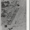 Old ore cars and ties of inclined railway at copper mine of Burro Mountain Copper Company. Tyrone, New Mexico