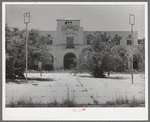 One of the main buildings with town square in foreground of the Burro Mountain Copper Company, now inactive, at Tyrone, New Mexico