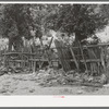 Fence made of wood and automobile parts at Georgetown, New Mexico