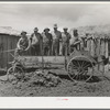 Members of FSA cooperative manure spreader. Box Elder County, Utah