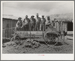 Members of FSA cooperative manure spreader. Box Elder County, Utah