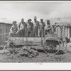 Members of FSA cooperative manure spreader. Box Elder County, Utah