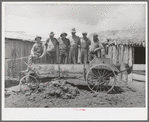 Members of FSA cooperative manure spreader. Box Elder County, Utah