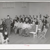 Meeting of the priesthood in Mormon church. This meeting is held on the first Sunday of every month and includes all males fourteen years of age and older. On this morning these men do without breakfast and give the saved money to the Bishop's fund. Mendon, Utah