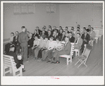 Meeting of the priesthood in Mormon church. This meeting is held on the first Sunday of every month and includes all males fourteen years of age and older. On this morning these men do without breakfast and give the saved money to the Bishop's fund. Mendon, Utah
