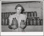 Wife of Mormon farmer with canned goods. Snowville, Utah