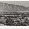 Farms on the outskirts of Logan, Utah, Cache County. At the foot of the mountain one of the levels of ancient Lake Bonneville can be seen