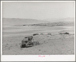 Ericson brothers' cooperative tractor, bought with FSA loan, plowing dry land. Irrigated land is seen in the middleground of the picture. Box Elder County, Utah