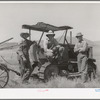 The Ericson brothers and their cooperative tractor bought with a FSA loan. Box Elder County, Utah