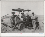 The Ericson brothers and their cooperative tractor bought with a FSA loan. Box Elder County, Utah