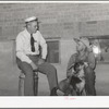 Mr. Thayne, FSA cooperative specialist, talking to one of the Ericson brothers about forming a cooperative tractor society. Box Elder County, Utah