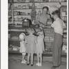 Mormon children buying candy at store. Mendon, Utah