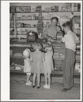 Mormon children buying candy at store. Mendon, Utah