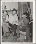 FSA county supervisor, center, looks over the books of the FSA cooperative stallion organization. Box Elder County, Utah