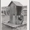Covered well on Spanish-American family. Chamisal, New Mexico