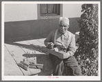 Old Spanish-American farmer with homemade tools. Chamisal, New Mexico