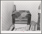 Trunk in corner of bedroom of Spanish-American farm. Chamisal, New Mexico