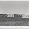 Adobe home of Spanish-American farmer. Chamisal, New Mexico