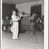 Young Spanish-American musician in traveling show at Penasco, New Mexico. These traveling shows are the main source of entertainment