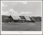 Hay barns of Spanish-American farmer at Llano, New Mexico