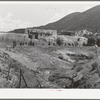 Spanish-American farmstead with stream running past. Amalia, New Mexico