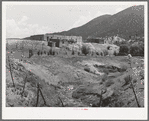 Spanish-American farmstead with stream running past. Amalia, New Mexico